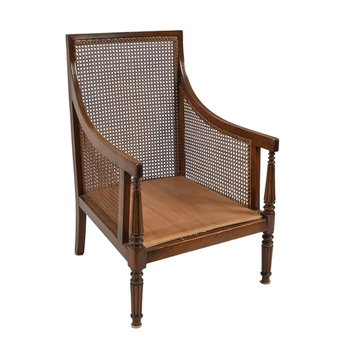 653 - A mahogany and caned bergère, c1900, in Regency style, 94cm h