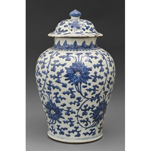 68 - A Chinese blue and white vase and cover, Kangxi period, painted with lotus meander, 40cm h... 