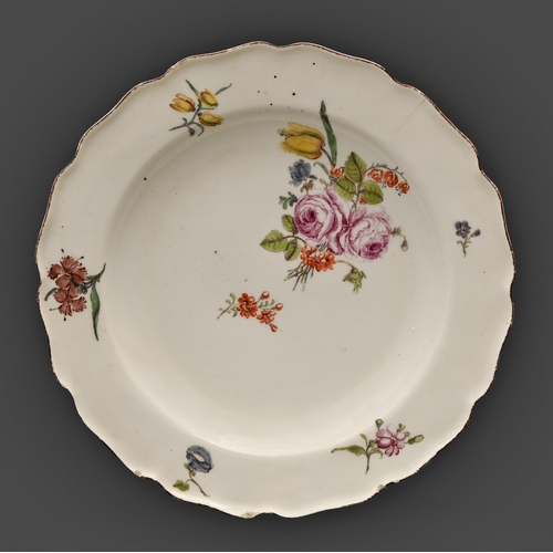 94 - A Chelsea plate, c1755, enamelled with flower sprays in iron red rim, 23cm diam, anchor in red ename... 