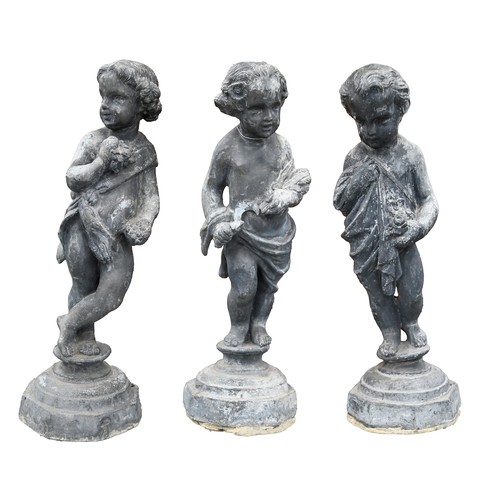 733 - Garden ornaments. A set of four lead figures of the infant seasons, mid 20th c, on octagonal base, 6... 