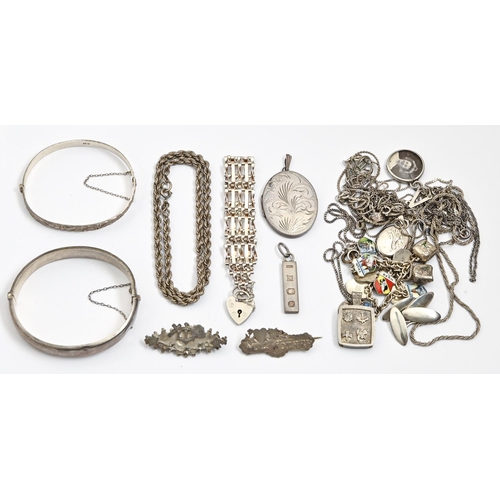 104 - Miscellaneous silver jewellery, Victorian and later, including bracelets, bangles and a silver charm... 