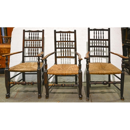 1095 - A set of six Victorian ash spindle-back rush seated dining chairs, including three elbow chairs... 