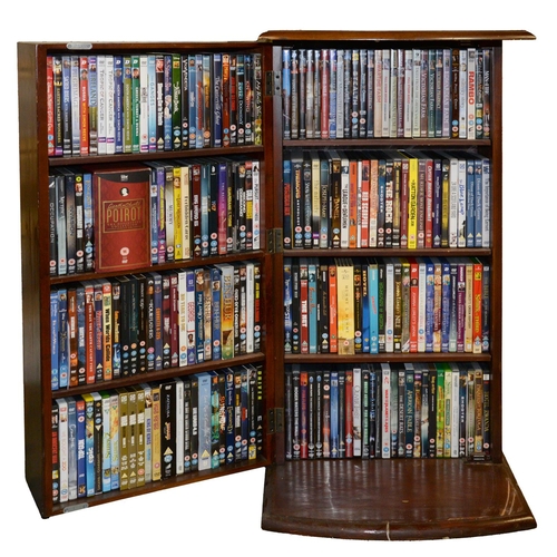 1231 - An extensive collection of DVDs, twelve boxes and a swing front storage cabinet, 95cm h... 