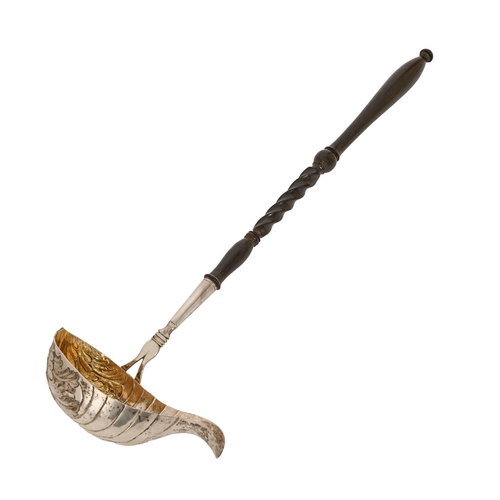 216 - A Continental silver punch ladle, 19th c, the fluted bowl chased with shells, turned ebonised handle... 