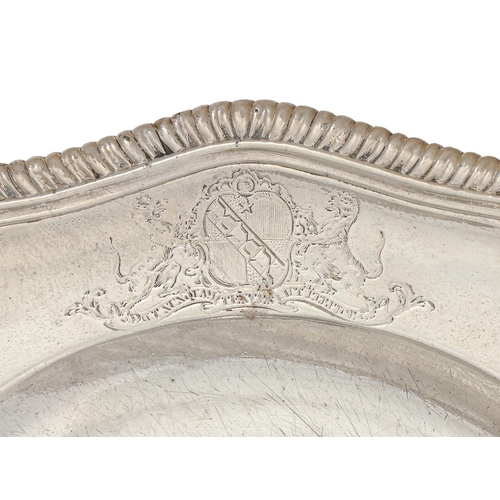 231 - A set of twelve George II silver dinner plates, with gadrooned rim, the shaped border engraved with ... 