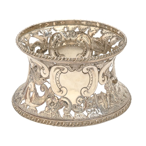 239 - A Victorian plated dish ring, chased in 18th c Irish style with birds, flowers and scrolls between g... 