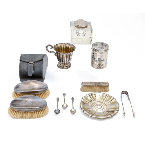 255 - A Turkish silver teacup and saucer, a silver mounted glass inkwell, a pair of brushes, several items... 