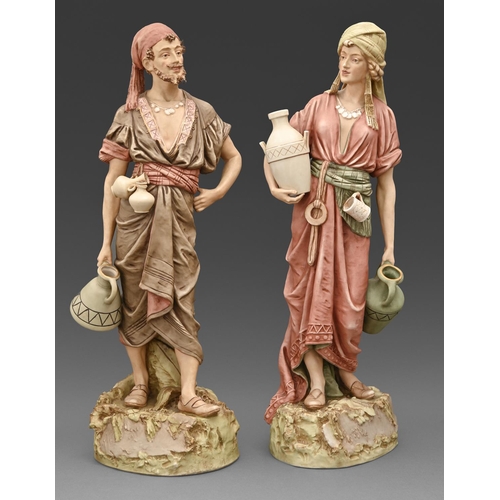 279 - A pair of Royal Dux orientalist figures of water carriers, c1910, 60cm h, no 1074 and 1075, mark imp... 