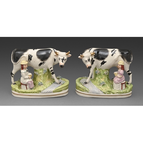 293 - A pair of Staffordshire models of cows, c1860, with children, 16cm h