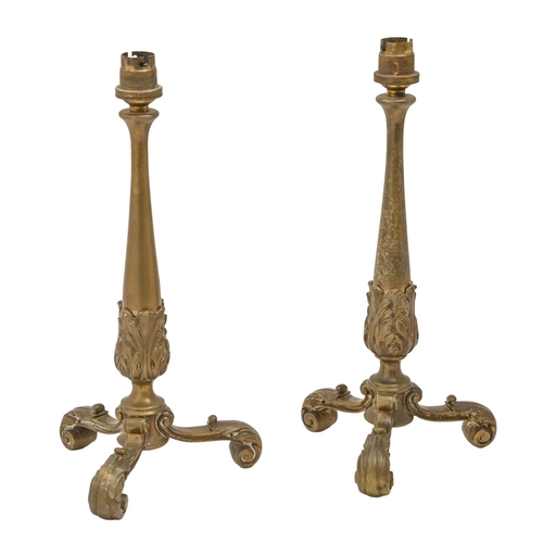 470 - A pair of brass tripod table lamps, 1910, on scrolling feet, impressed registration marks RD588968, ... 