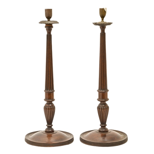 526 - A pair of mahogany neo-classical style fluted candlesticks, late 19th c, 53cm h