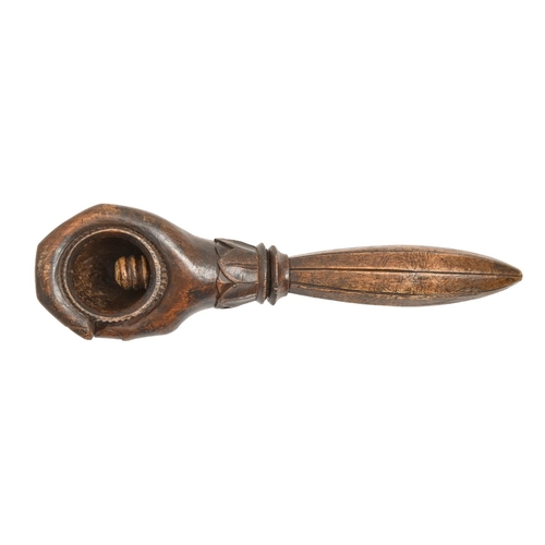 554 - Treen. A Victorian walnut nutcrack in the form of a hand, 20cm l