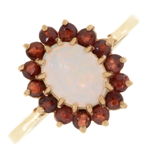 60 - An opal and garnet ring, in 9ct gold, part marked, 2.2g, size M