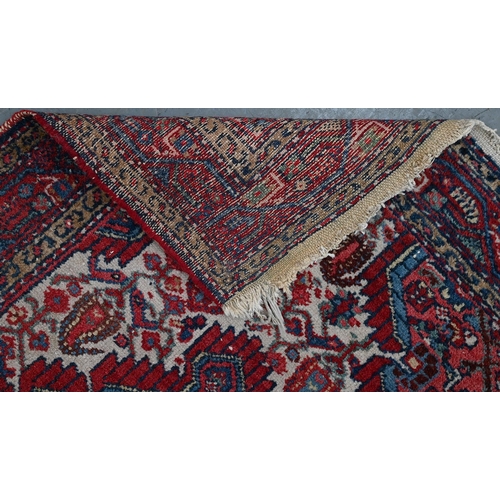 940 - A Middle Eastern rug, 133 x 115cm and another, smaller, 123 x 79cm