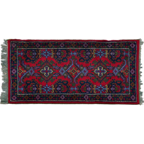 941 - A Middle Eastern wool rug, 182 x 89cm and an Indian needlework rug, 215 x 152cm