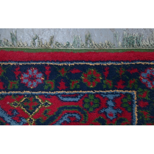 941 - A Middle Eastern wool rug, 182 x 89cm and an Indian needlework rug, 215 x 152cm