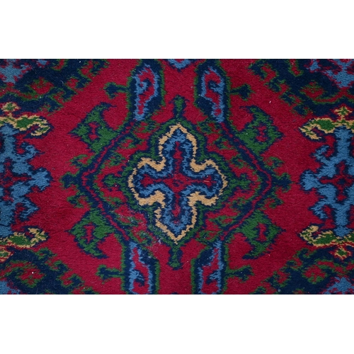 941 - A Middle Eastern wool rug, 182 x 89cm and an Indian needlework rug, 215 x 152cm