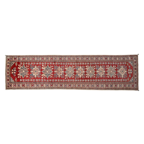 943A - A Middle Eastern runner, 316 x 80cm and two others, 128 x 77cm and 397 x 86cm