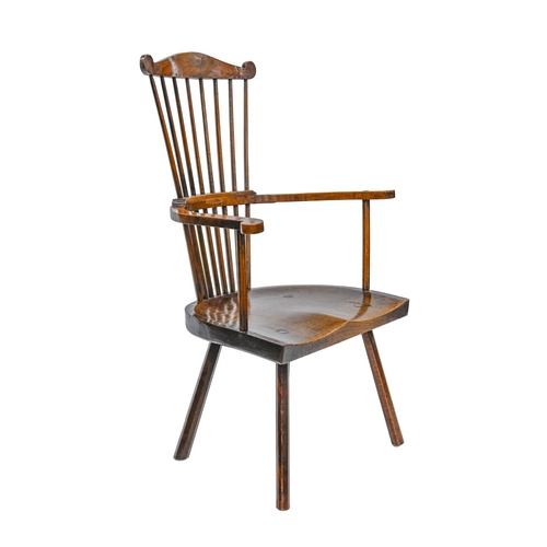 982 - An unusual British ash and fruitwood comb-back Windsor chair, first half 19th c, with substantial sh... 