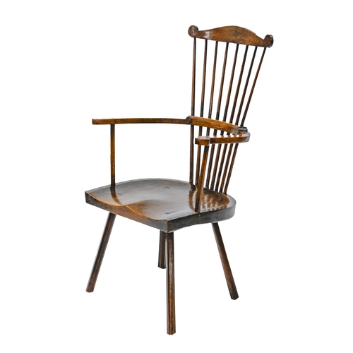 982 - An unusual British ash and fruitwood comb-back Windsor chair, first half 19th c, with substantial sh... 