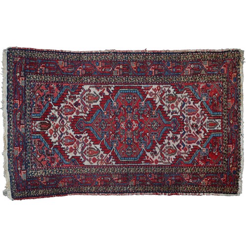 940 - A Middle Eastern rug, 133 x 115cm and another, smaller, 123 x 79cm