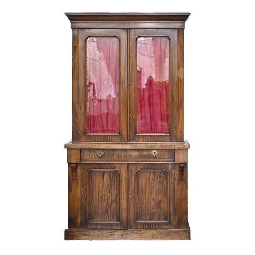 1038 - A Victorian stained mahogany glazed bookcase, the lower part enclosed by a pair of panelled doors, 2... 