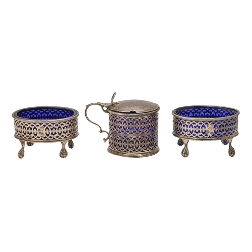 413 - A pair of George III pierced oval silver salt cellars and a mustard pot en suite, crested, blue glas... 