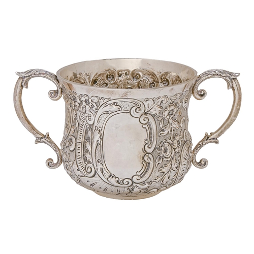 424 - A Victorian silver porringer, chased with flowers and C scrolls on a matted ground, 88mm h, by Wakel... 