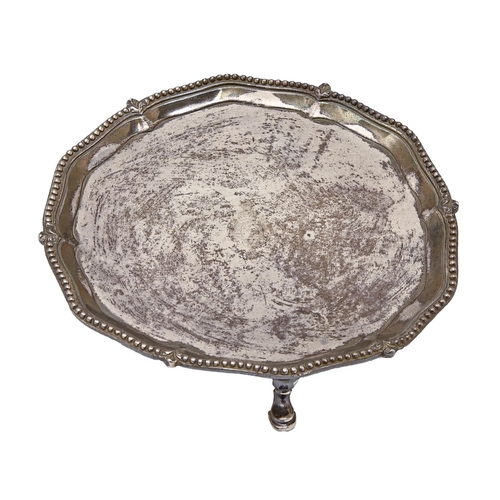 438 - A George III silver waiter, the moulded border with gadrooned rim, on three hoof feet, engraved with... 