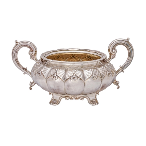 463 - A George IV silver melon form sugar bowl, crisply chased with leaves and flowers, 20.5cm over handle... 