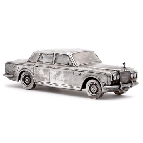 474 - An Elizabeth II silver model of a Rolls Royce Silver Shadow motor car, 21cm l, the underside engrave... 