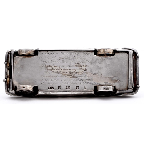 474 - An Elizabeth II silver model of a Rolls Royce Silver Shadow motor car, 21cm l, the underside engrave... 