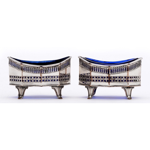 478 - A pair of Sheffield Plate pierced octagonal salt cellars, late 18th c, on fluted feet, blue glass li... 