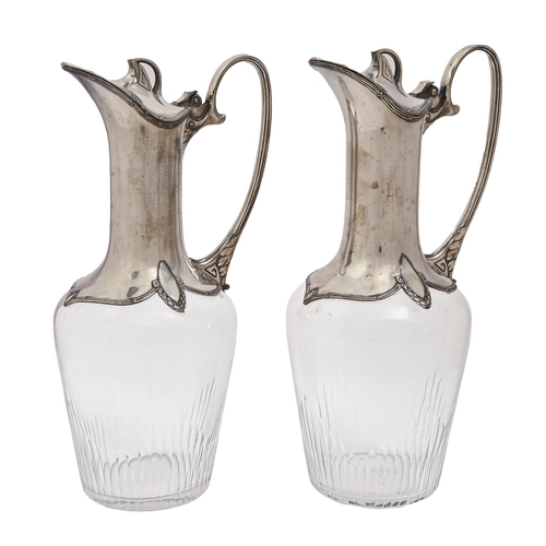 503 - A pair of Continental art nouveau EPNS mounted glass claret jugs, c1910, 28cm h