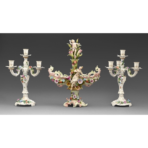 531 - A pair of Carl Thieme porcelain candelabra, early 20th c, painted and applied with flowers, printed ... 