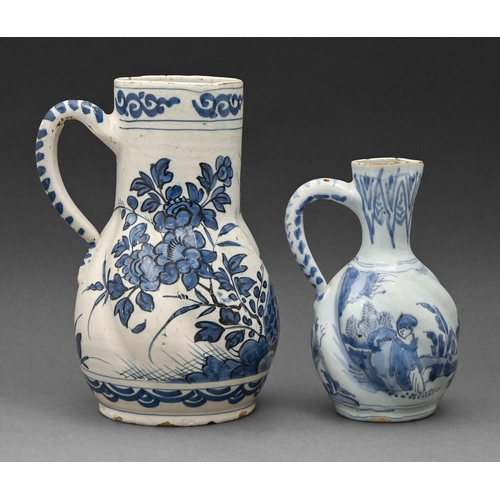 536 - A German spirally lobed faience jug and a similar smaller Delftware jug, probably Dutch, both 18th c... 