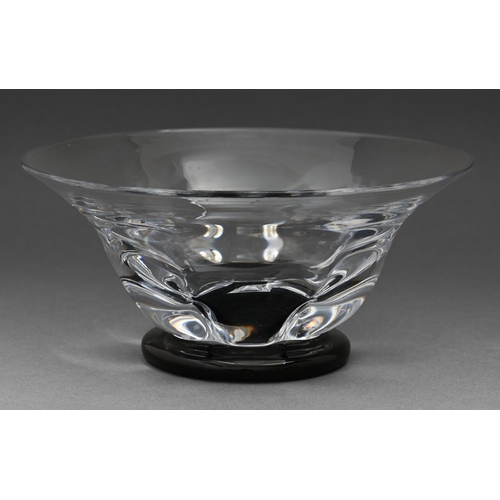 537 - An Orrefors glass bowl, designed by Edvard Hald, on black foot, 21.5cm diam, engraved marks... 