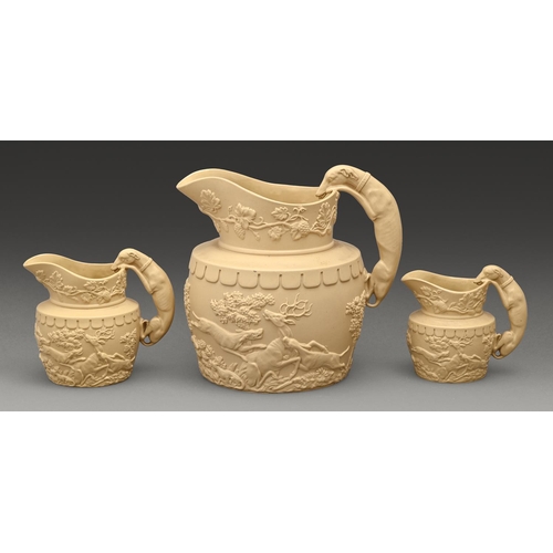 539 - A set of three Phillips & Bagster graduated caneware jugs, c1820, with hunting dog handle, mould... 