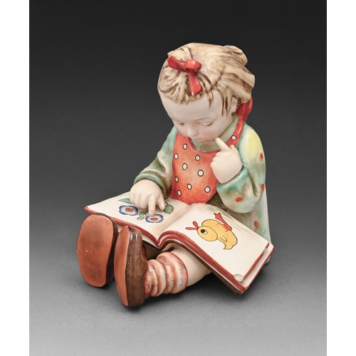 563 - A Trentham Artware 'Bookworm' figure, mid 20th c, 20cm, maker's label to base