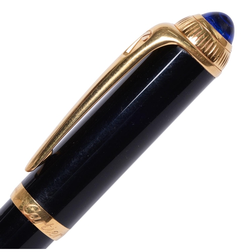 707 - A Cartier rollerball pen, K171724, mounted with a blue resin cabochon, 14cm l