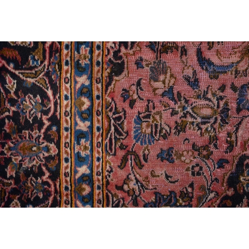 928 - A Persian carpet, 285 x 192cm