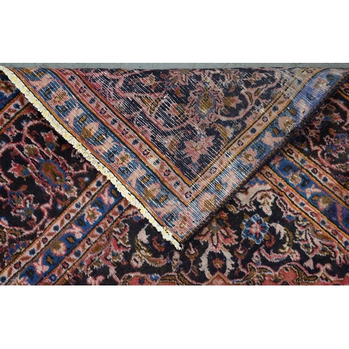 928 - A Persian carpet, 285 x 192cm