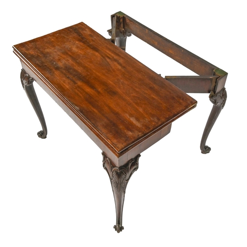 942 - A George II mahogany card table, with concertina action, on carved legs with volute feet, 73cm h; 45... 