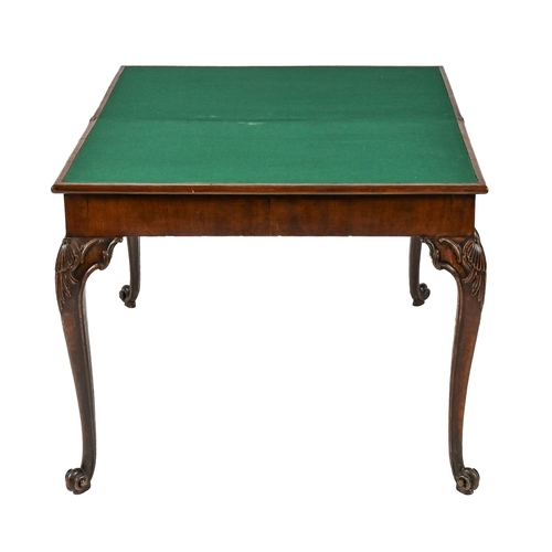 942 - A George II mahogany card table, with concertina action, on carved legs with volute feet, 73cm h; 45... 