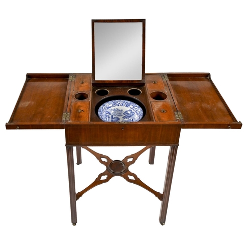 946 - A George III mahogany gentleman's dressing table, the caddy moulded, flame figured, divided top open... 