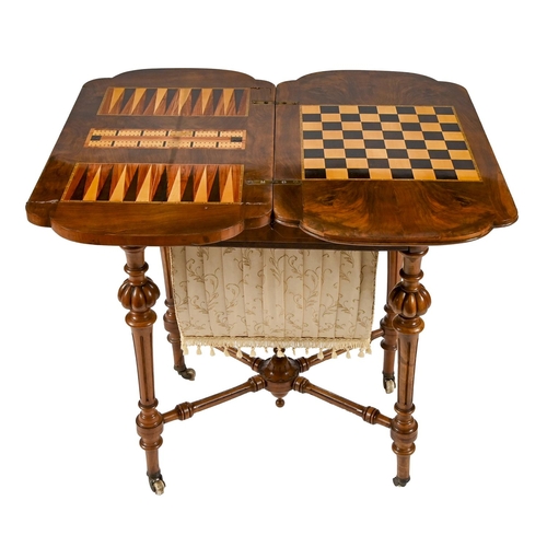 973 - A Victorian bow-ended walnut and inlaid games/work table, with quarter veneered top, on pottery cast... 