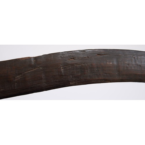 659 - An Australian Aboriginal boomerang, 19th c, bound at one end, 71cm l