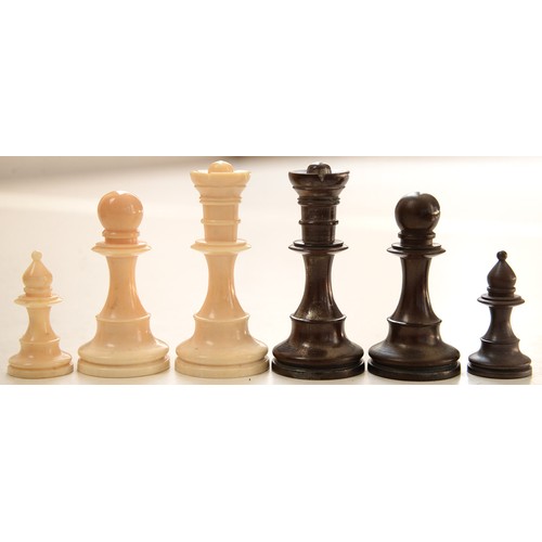 702 - A turned bone chess set, 19th/early 20th c, stained brown or natural, kings 72mm h (32)... 