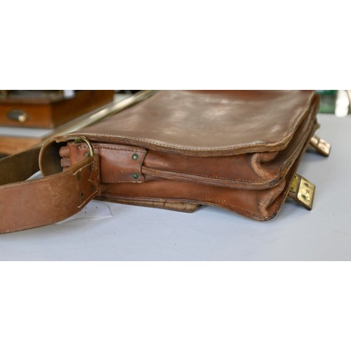 669 - A leather satchel, c1930, with brass fastenings, the inside stamped A B L, 40cm w