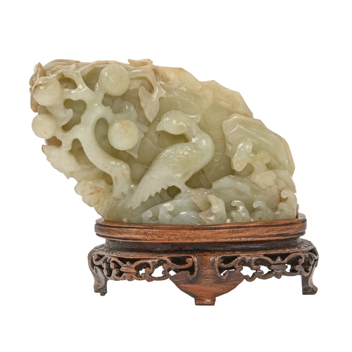 745 - A Chinese jade carving of a bird in tree, early 20th c and a contemporary pierced and carved hardwoo... 